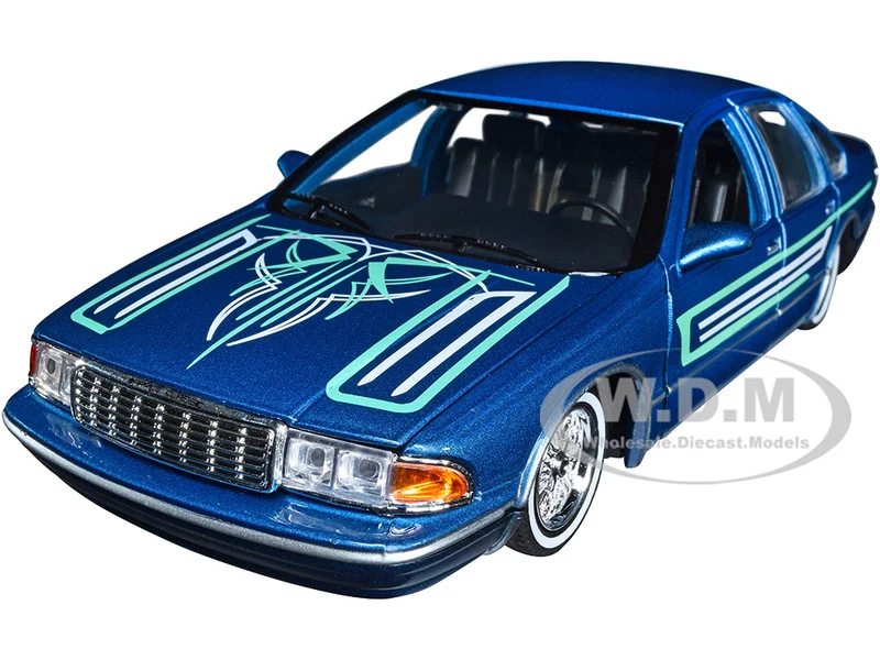 1993 Chevrolet Caprice Lowrider Blue Metallic with Graphics "Get Low" Series 1/24 Diecast Model Car by Motormax - Chevrolet Models