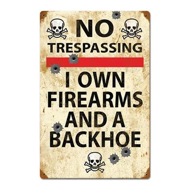 "No Trespassing: I Own Firearms and a Backhoe" Metal Sign - Vintage Sign Co.